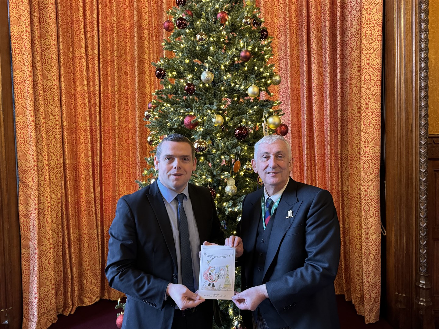 Speaker of the House of Commons Lindsay Hoyle with his copy of the card.