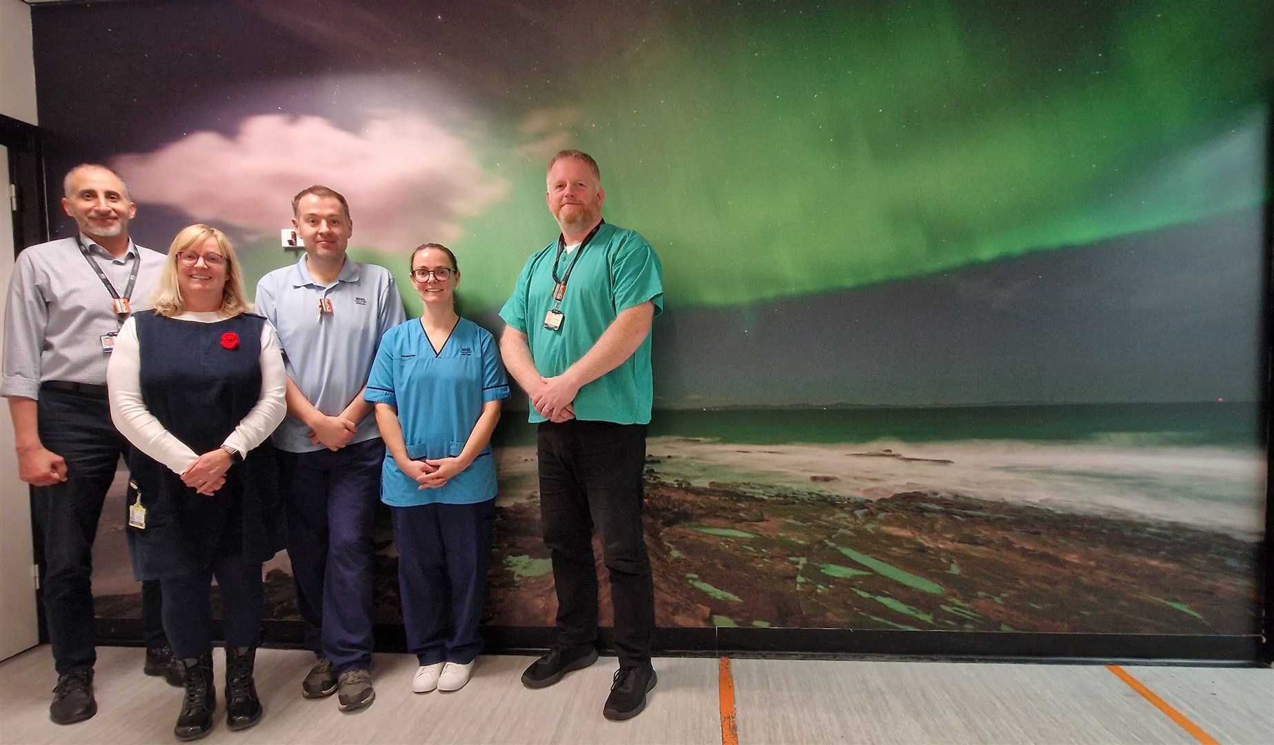 The stunning Northern Lights over Burghead, from left, Dr Rafik (consultant radiologist), Morag Howard (radiology site superintendent), Christopher Dafter (health care support worker), Jennifer Monkhouse, (sonographer/radiographer) and Struan Wilkie (consultant radiologist).