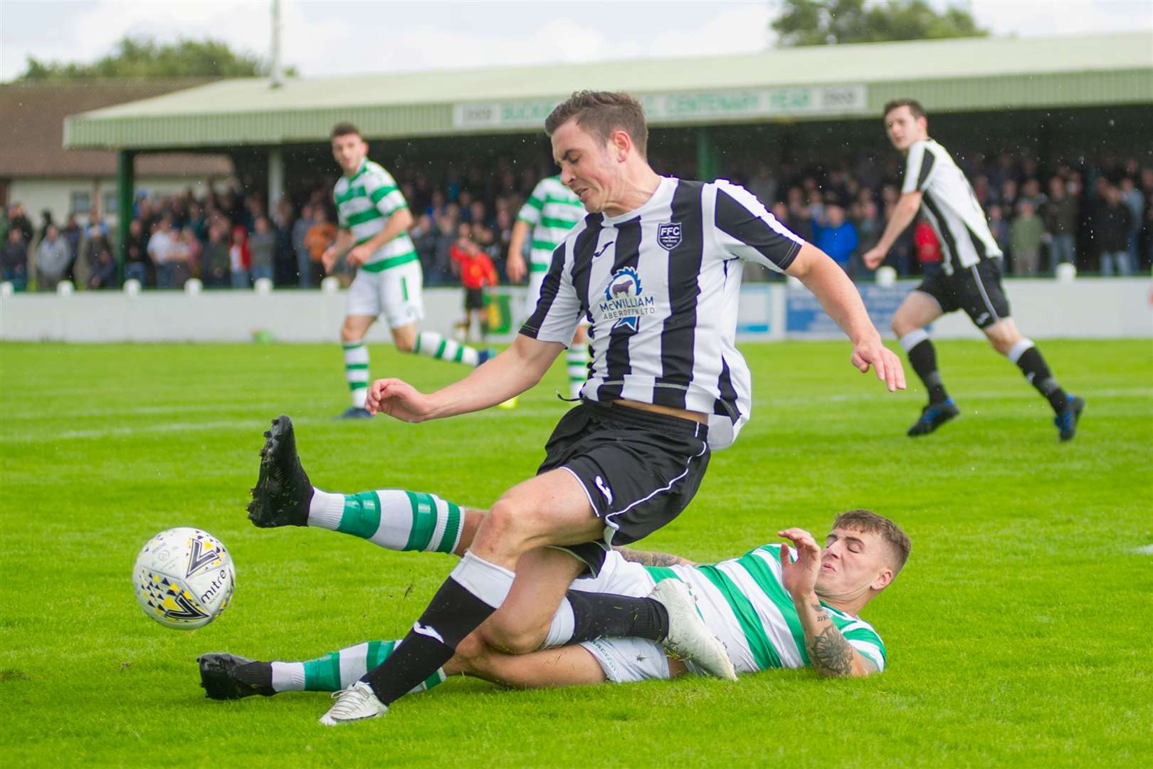Buckie Thistle's Joe McCabe slides in on Fraserburgh's Paul Campbell to win the ball back for the home side...Buckie Thistle (1) vs Fraserburgh FC (2) - Victoria Park, Buckie - Highland Football League 17/08/2019...Picture: Daniel Forsyth. Image No.044617.