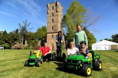 Helping young Olaf Duszynska have a go on the mini John Deere tractor ahead of tomorrow's games are Zara and Angus Gordon Lennox, of Gordon Castle, while Moray College tourism volunteer Sarah Sutherland tries out a Segway glider.