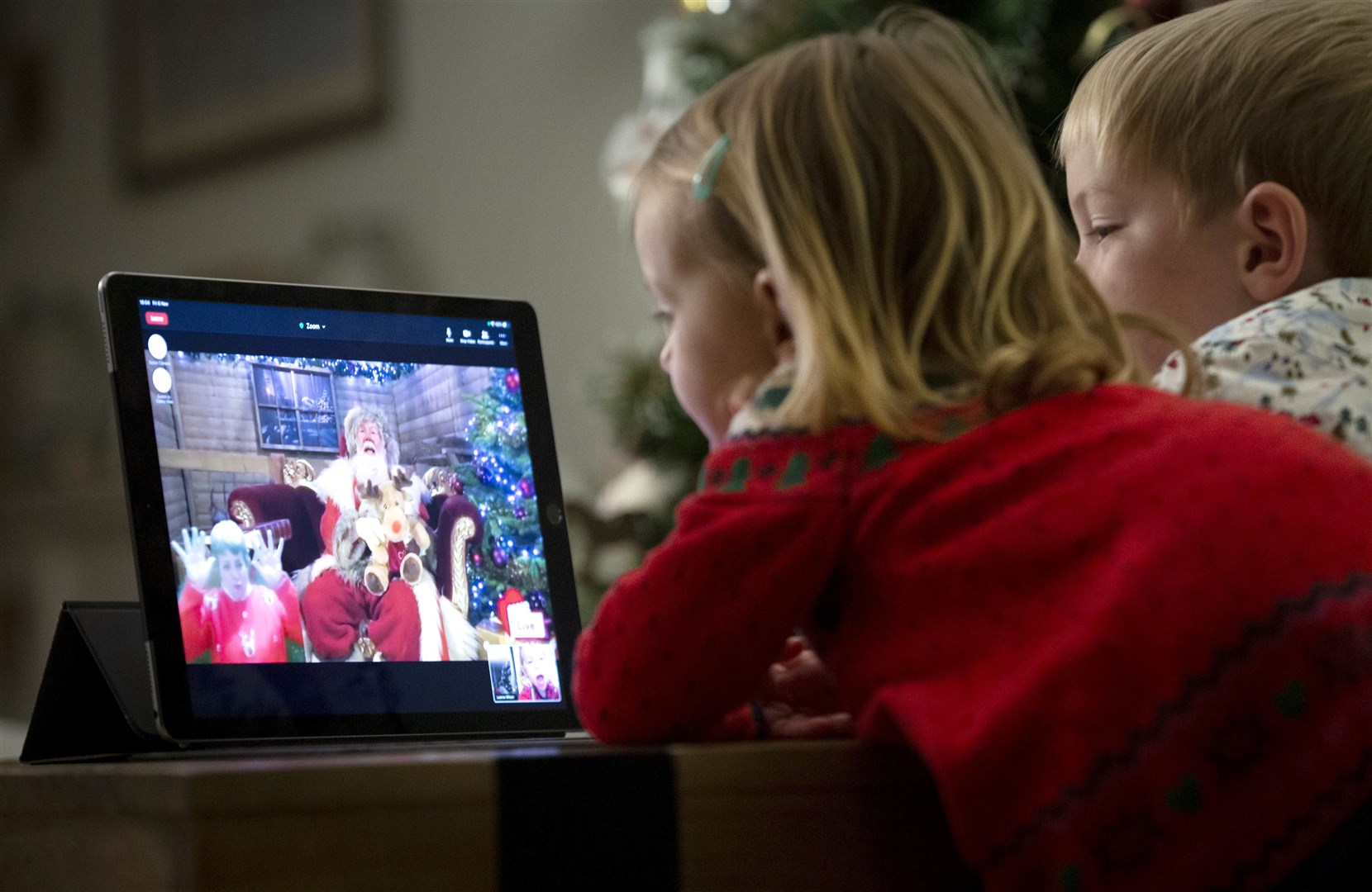 Amelia, aged 2, and Jacob, aged 4, talk to Santa Claus via live video stream.