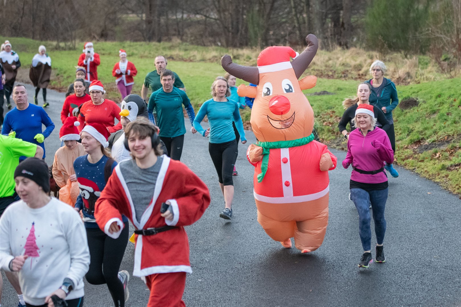 Runners ran with festive outfits...Elgin Christmas Day parkrun 2023...Picture: Daniel Forsyth..
