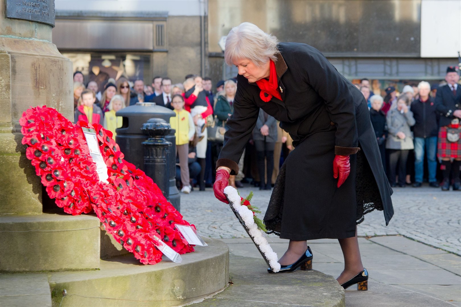 Maureen Jarvis lays a wreath on behalf of the War Widdows Association at the Elgin Memorial...2018 Elgin Remembrance Sunday parade and wreath laying. ..Picture: Daniel Forsyth. Image No.042559.