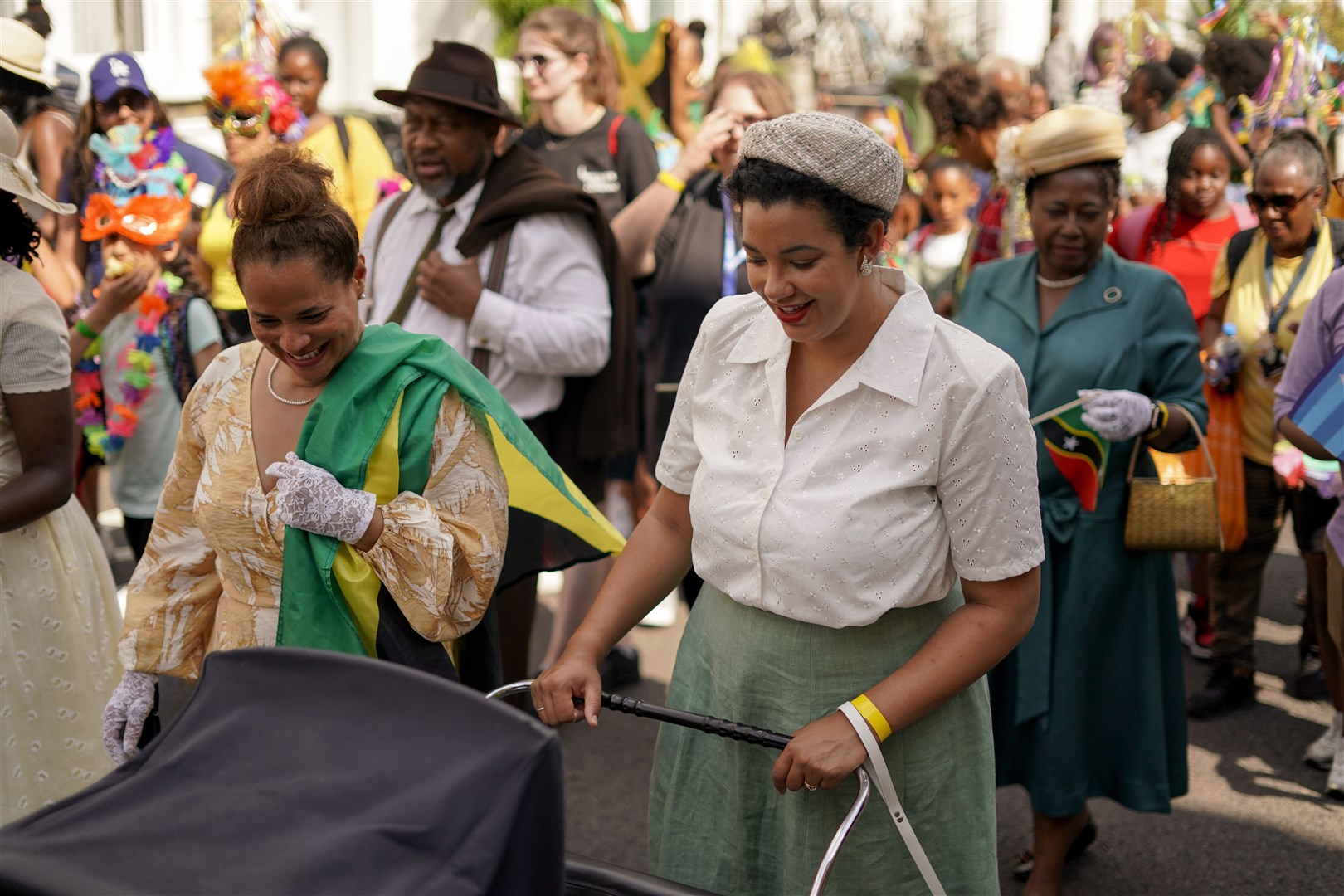 Many of those in the parade carried Caribbean flags (Alberto Pezzali/AP)