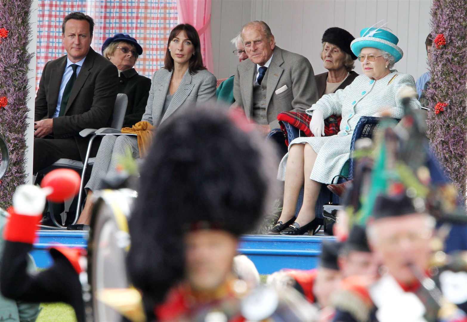 The Queen watching proceedings with, left to right, David Cameron, his wife Samantha Cameron and the Duke of Edinburgh at the Braemar Gathering in Braemar (Andrew Milligan/PA)