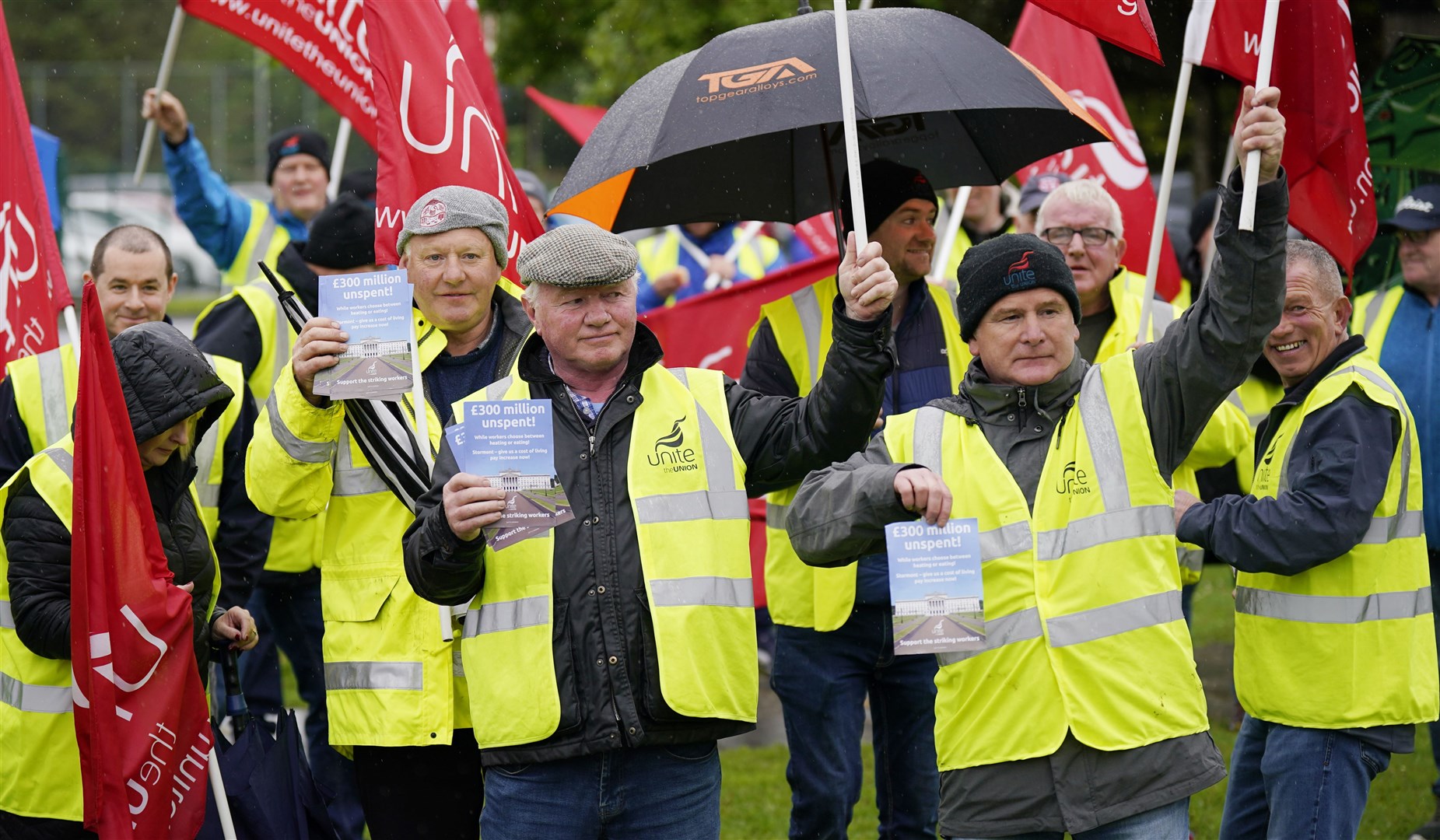 Striking council workers protest outside the Northern Ireland Assembly election count centre at Meadowbank Sports arena in Magherafelt (Niall Carson/PA)