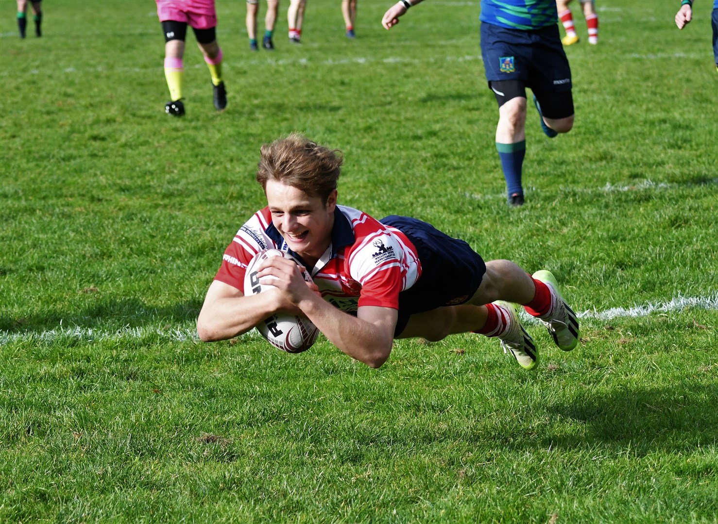 A big smile from Iain Stuart as he goes over for a try. Picture: James Officer