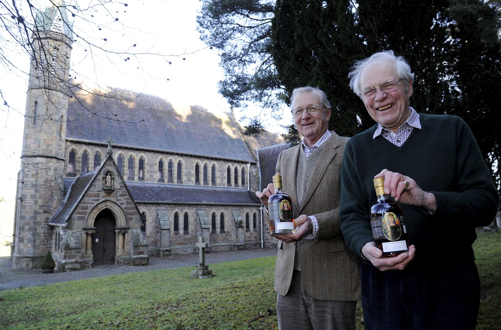 Members of St Margaret's Church Angus Findlay (right) and Chris Peel with two of limited-edition bottles. Picture: Eric Cormack.