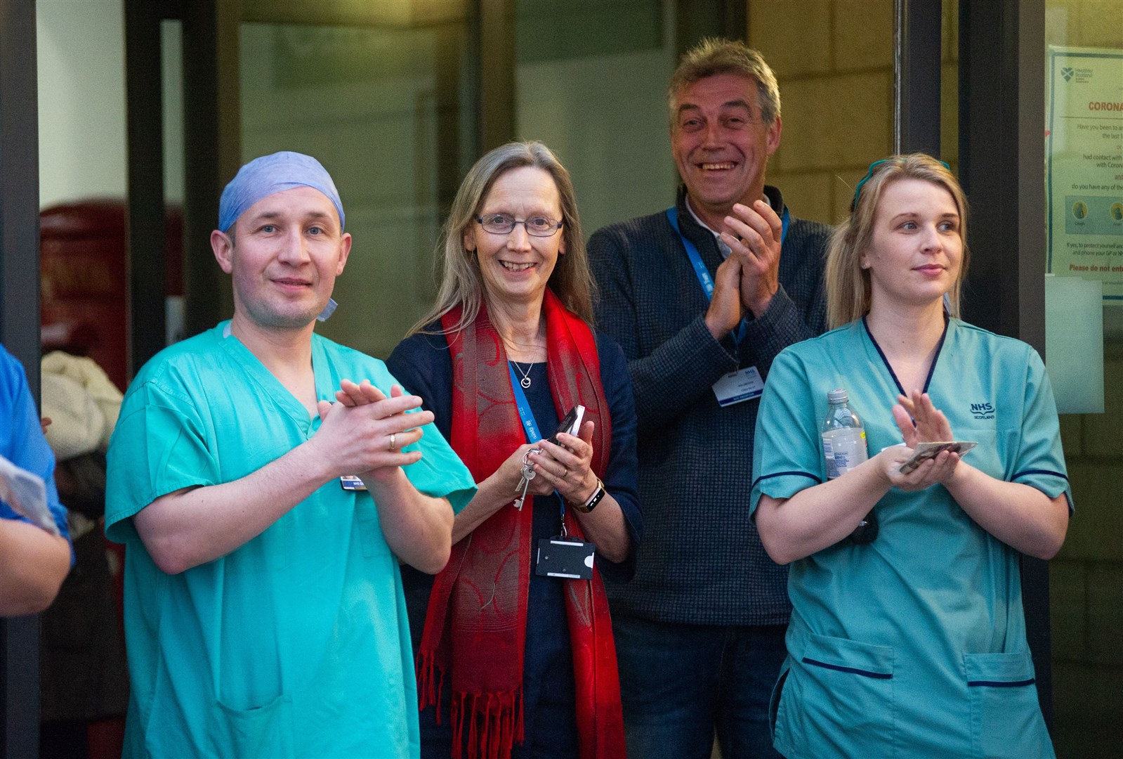 NHS Grampian staff members at Dr Grays Hospital in Elgin come outside at 8pm on Thursday April 9th to observe the Clap for Carers as they show their appreciation for the work each other are doing during the coronavirus pandemic. ..Picture: Daniel Forsyth..