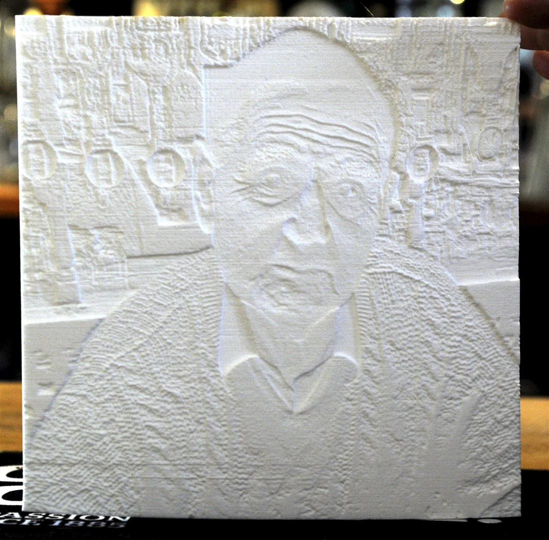 A lithophane created on a 3D printer by Ali's son Guy. When lit from behind it ...