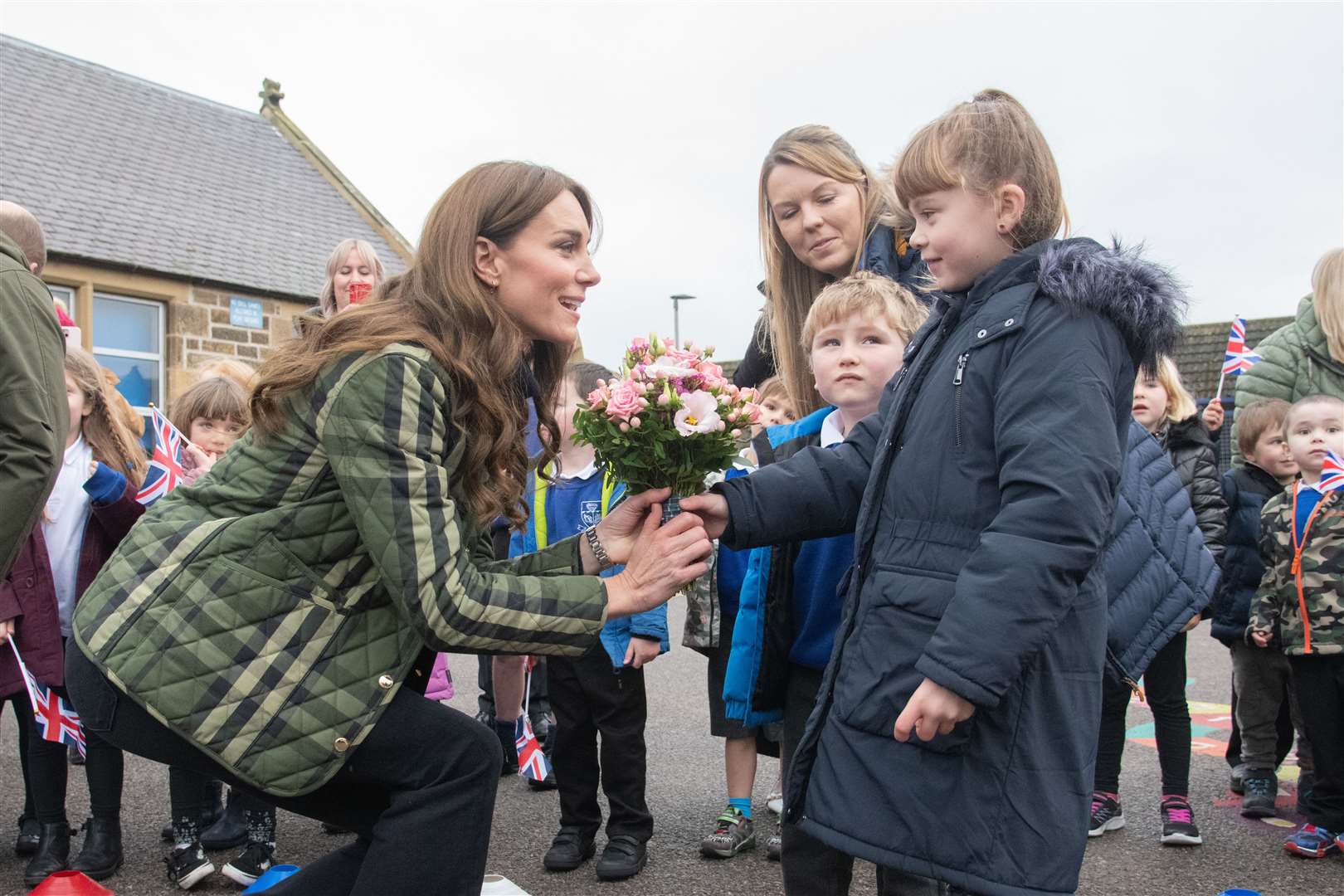 Ruby Grant hands Princess Kate flowers on behalf of Burghead Primary School with fellow pupil James Young..Picture: Daniel Forsyth..