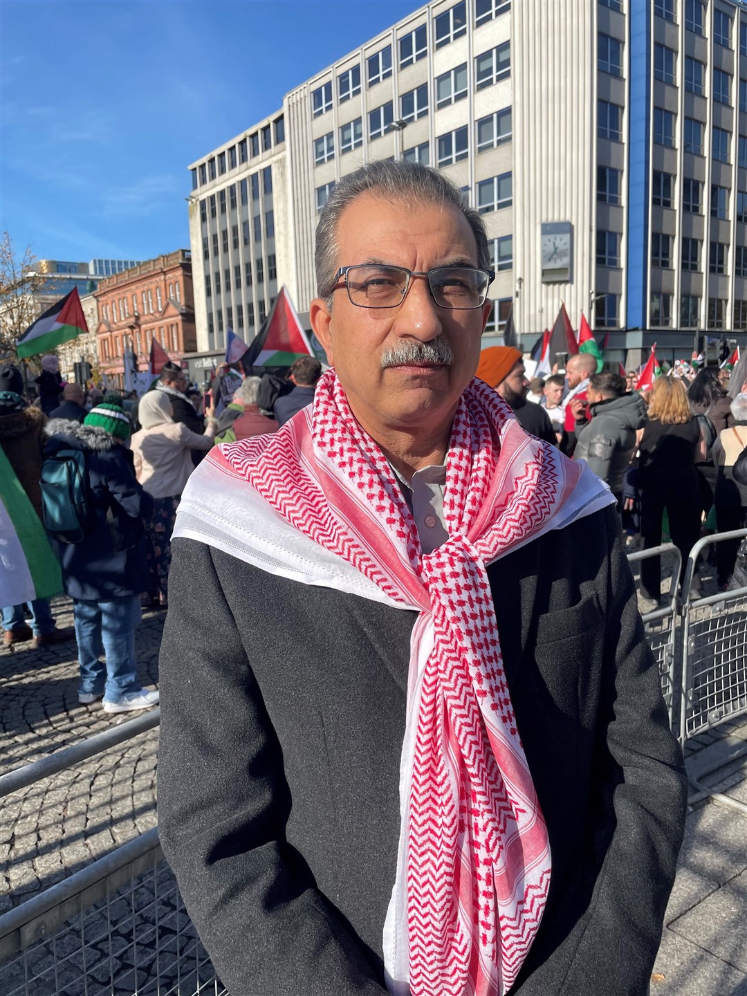 Dr Raied Al-Wazzan, from the Northern Ireland Council for Racial Equality, took part in the rally in Belfast (Jonathan McCambridge/PA)