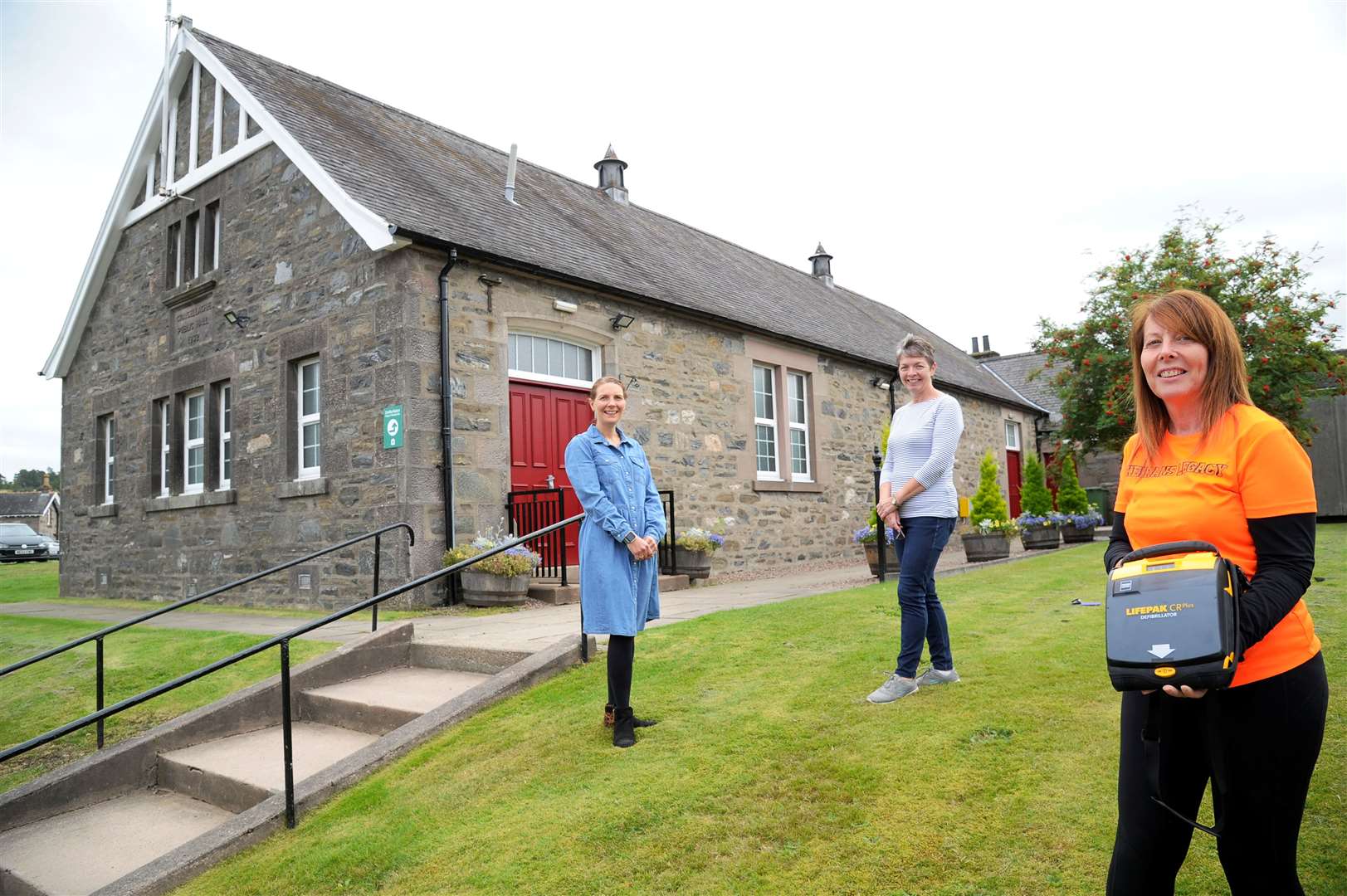 Craigellachie Hotel's defibrillator has been moved to the Village Hall to make it more accessible. Sandra McAndie of Keiran's Legacy [right] with Craigellachie Village Hall secretary Brenda Cooper (centre) and committee member Laura Strathdee (left). Picture: Eric Cormack