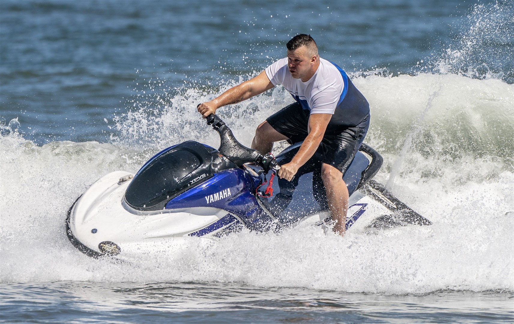 A man on a jet ski takes to the water in Scarborough (Danny Lawson/PA)