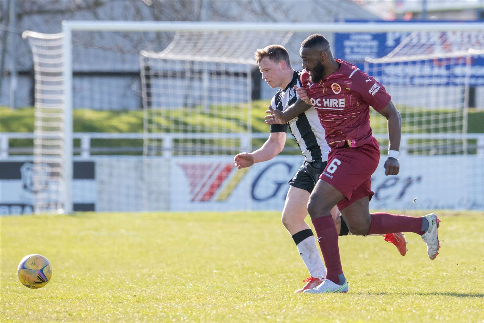 Elgin City's Angus Mailer tussles with Stenny's Nathaniel Wedderburn. Picture: Daniel Forsyth.