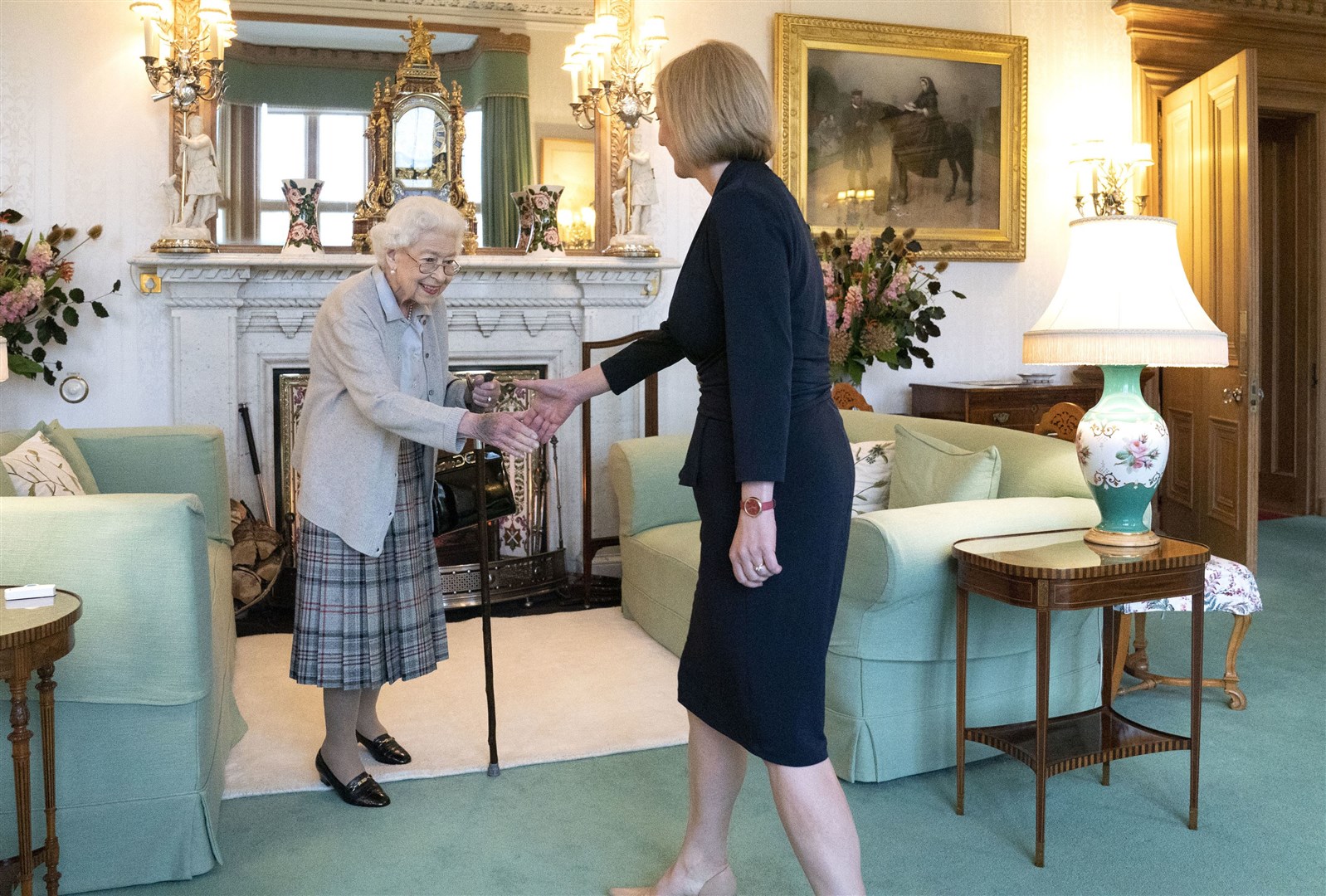 The Queen welcoming Liz Truss during her final official engagement at Balmoral (Jane Barlow/PA)