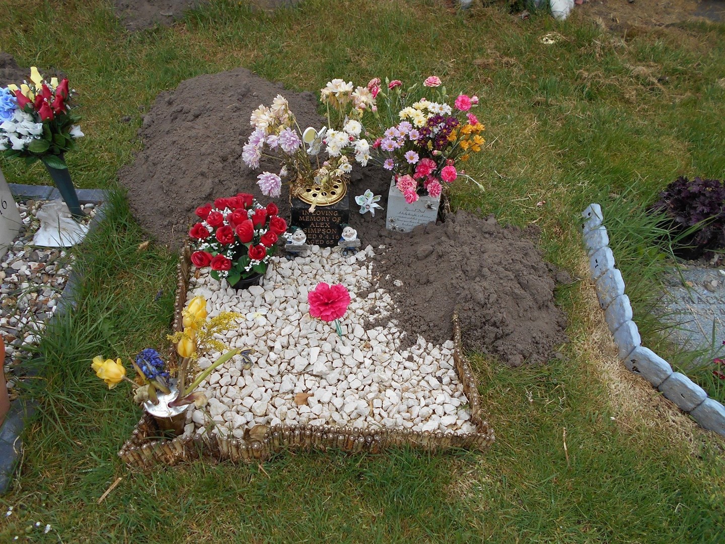 Julie's dad's grave has been attacked by moles.