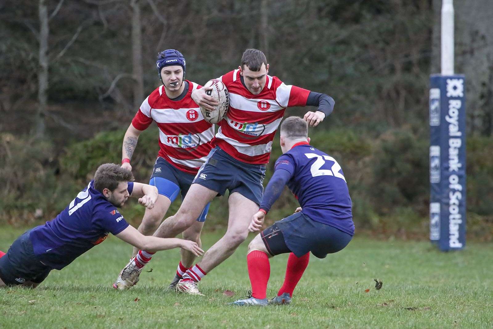 Archie Duncan trying to step past defenders. Connor McWilliam in background. Photo: John MacGregor