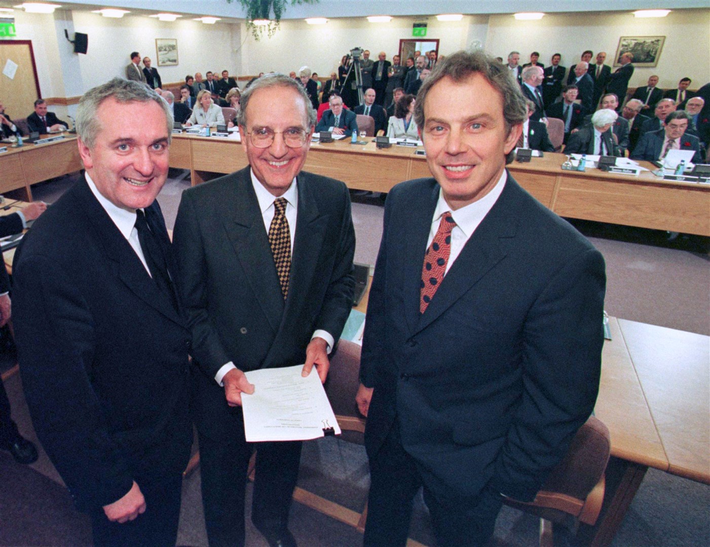 Tony Blair, former US senator George Mitchell and Bertie Ahern after they signed the Good Friday peace agreement (Dan Chung/PA)