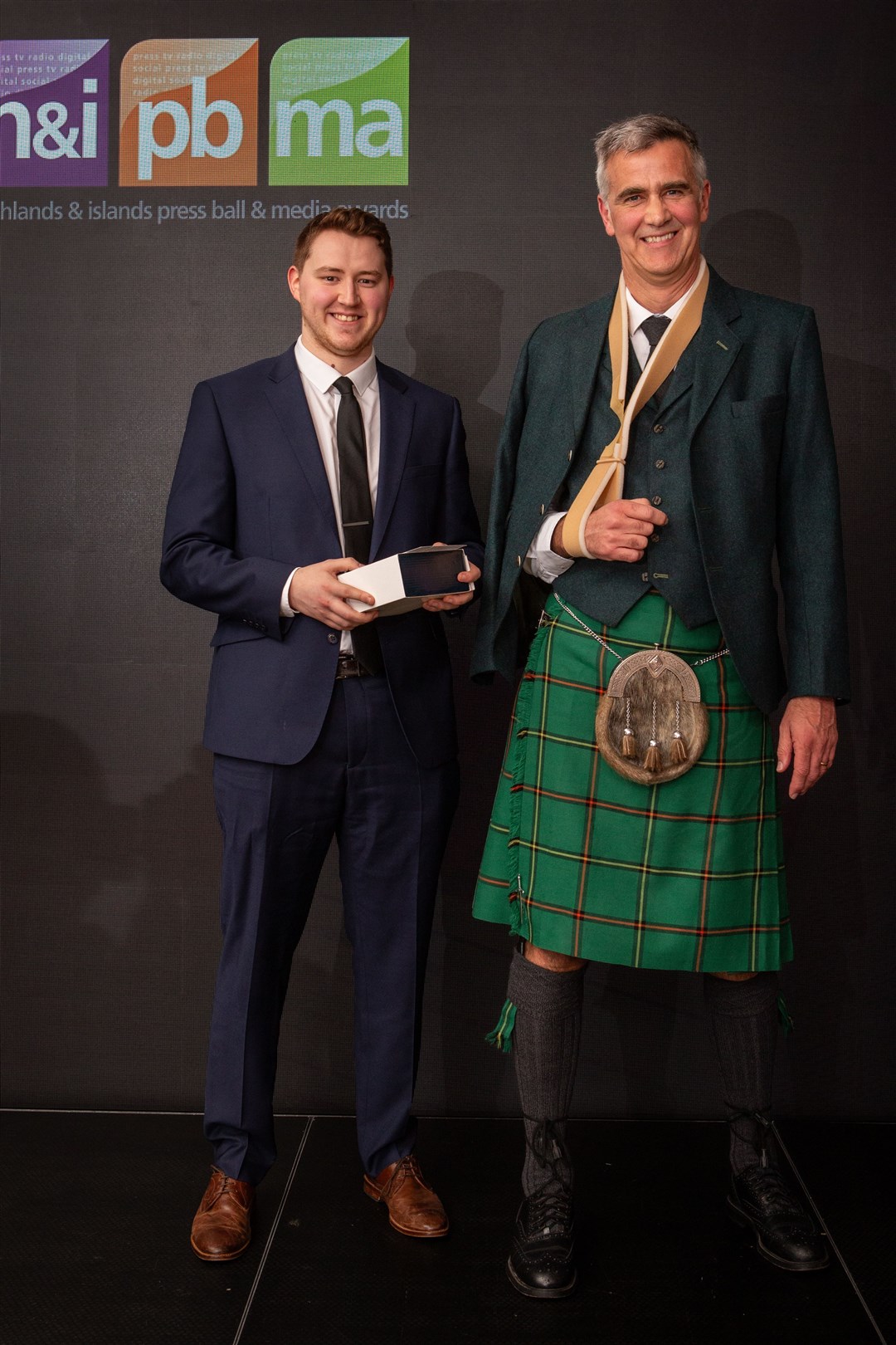 Ewan Malcolm (left) with Colin Marr collecting business writer of the year. Picture: Alison Gilbert