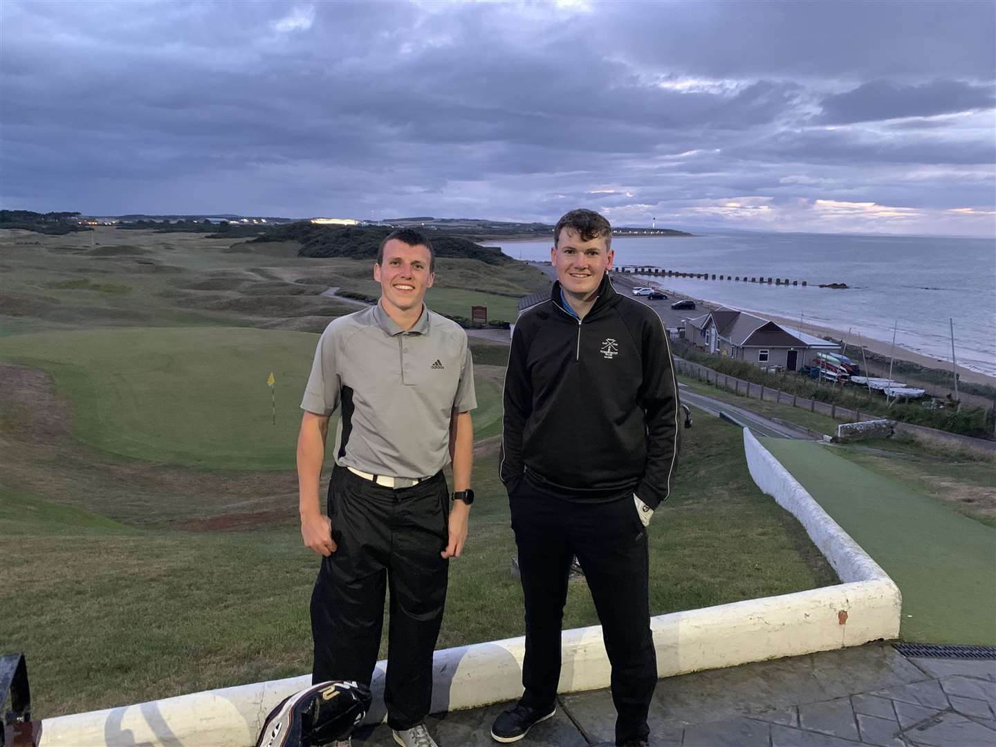 Aaron Stewart (left, from Lossie) and Scott Lorimer (right, from Montrose) finished 18 hours of golf just before dark at Moray Golf Club.