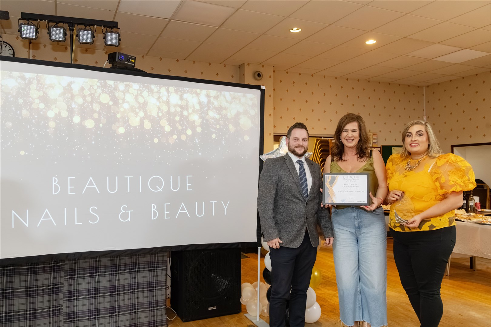 Darren MacDonald presenting the hair and beauty category award to Marie Slater and Mia Davies of Beautique Nails & Beauty. Picture: Beth Taylor.