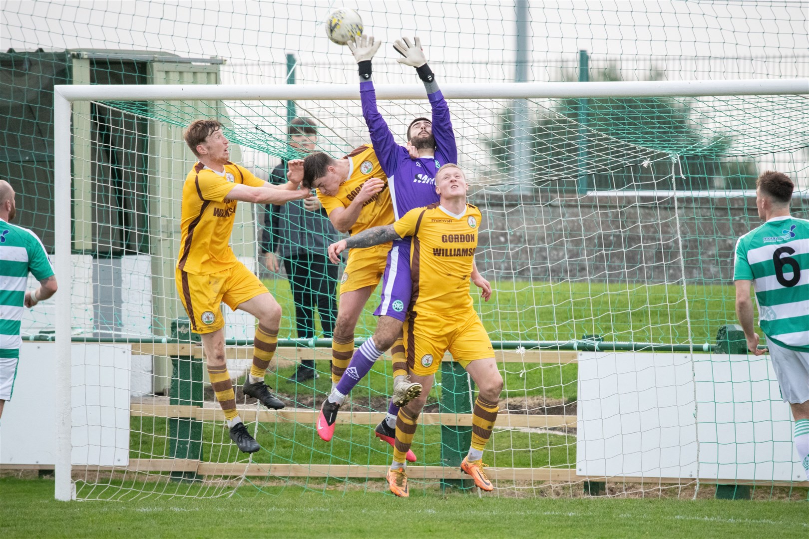 Buckie Thistle's keeper Balint Demus under pressure from a trio of Cans...Buckie Thistle FC (2) vs Forres Mechanics FC (0) - Highland Football League 22/23 - Victoria Park, Buckie 29/10/2022...Picture: Daniel Forsyth..