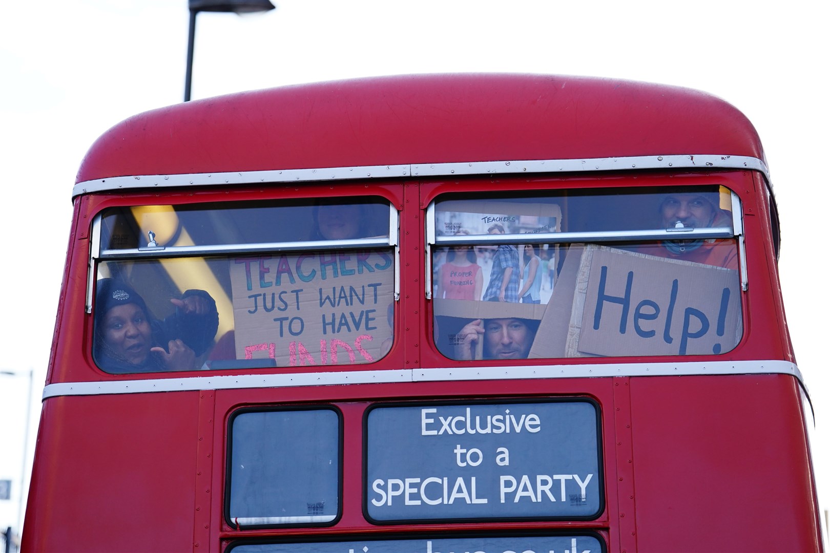 Striking teachers from the National Education Union (NEU) board a Routemaster bus in Lewisham, south-east London, to travel into central London for the Protect The Right To Strike march and rally against the Strikes (Minimum Service Levels) Bill (Jordan Pettitt/PA)