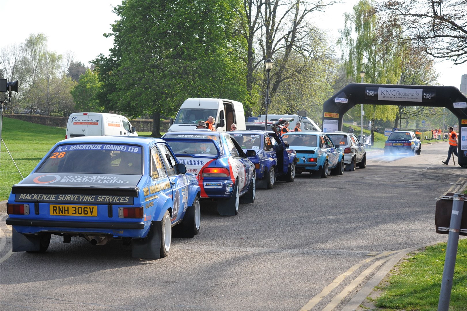The competitors queue up at the start of the first Cooper Park stage.