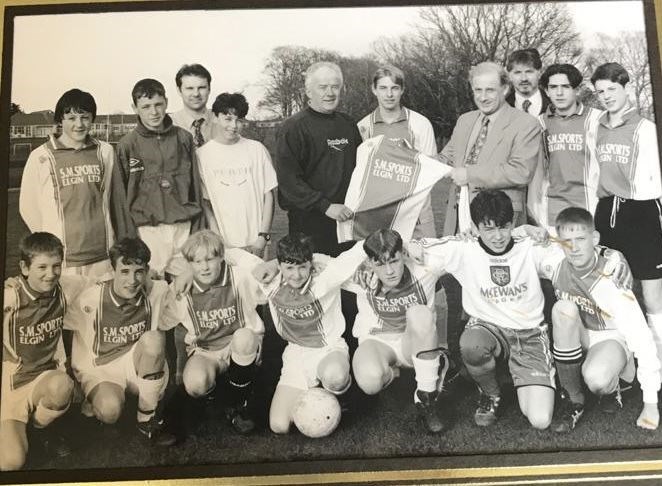 Elgin Academy's football team from the late 1990s, including John Blair (three from the left, front row).