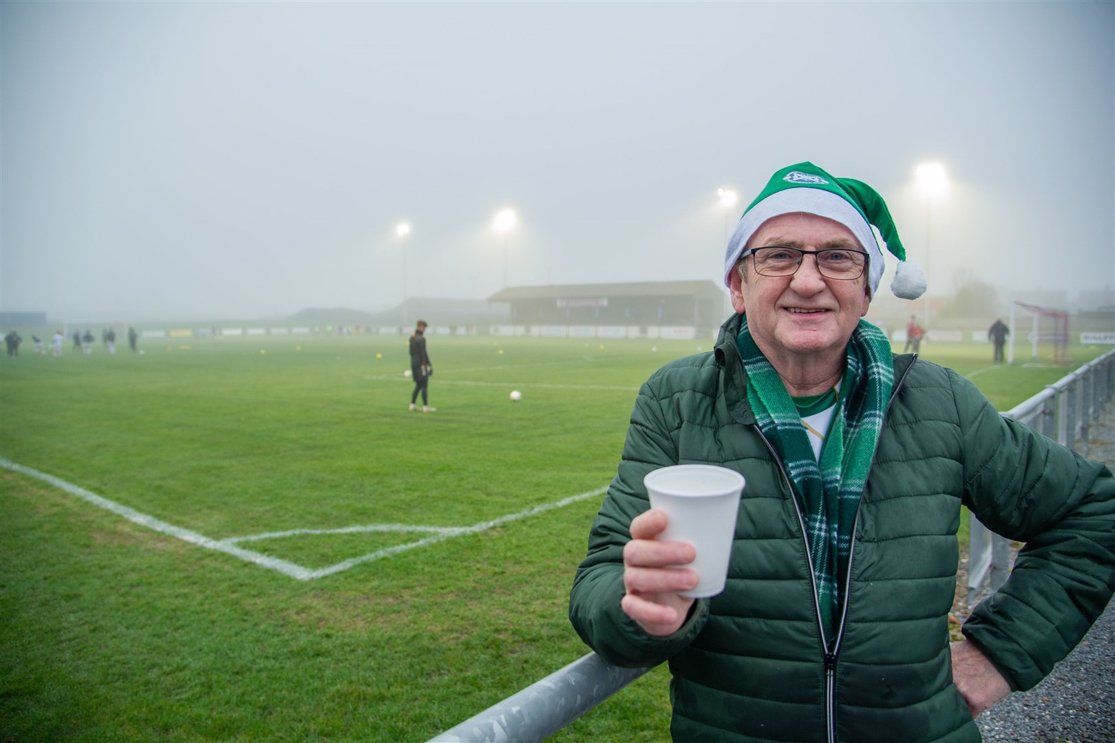 One festive Buckie supporter still smiling despite the call off. Picture: Daniel Forsyth..