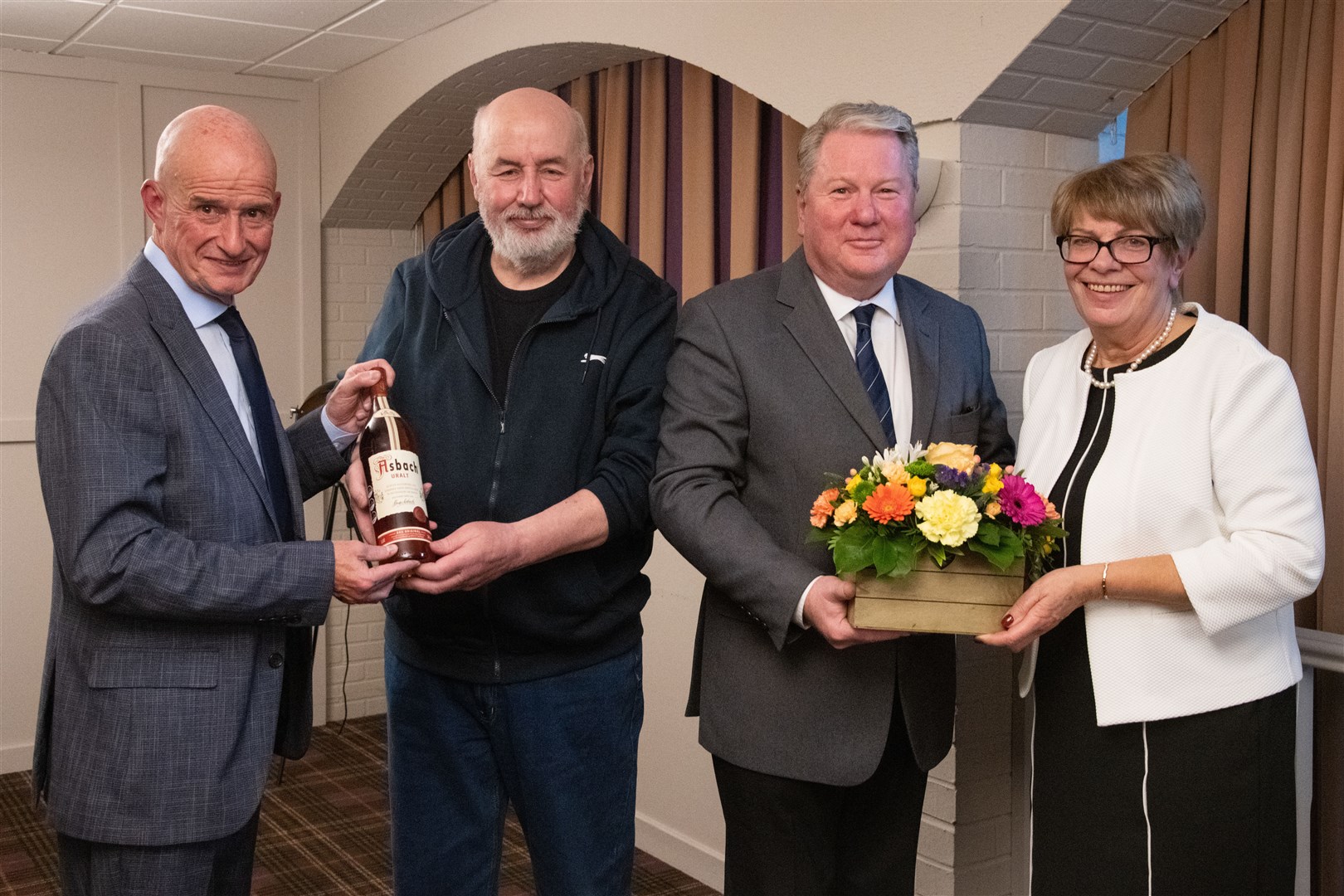 From left; David Christie (Forres branch manager), Norman Ralph (retiring after 40 years), Ian Palmer (Chief Executive - White & Company) and Fiona Murphy (retiring after 28 years)...Double retirement from White's and Company in Forres...Picture: Daniel Forsyth..