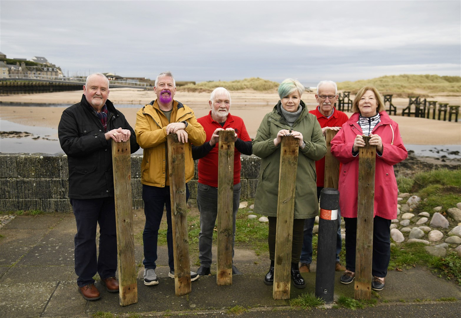 From left: Rab Forbes (Lossiemouth Community Development Trust), George McLean, Pete Weatherhead (Elgin Men's Shed), Donna McLean (Memeber of Lossiemouth Business Association), Davie Bain (Elgin Men's Shed) and Lily Mulholland are selling parts of the old bridge at Lossiemouth for charities...Picture: Beth Taylor.