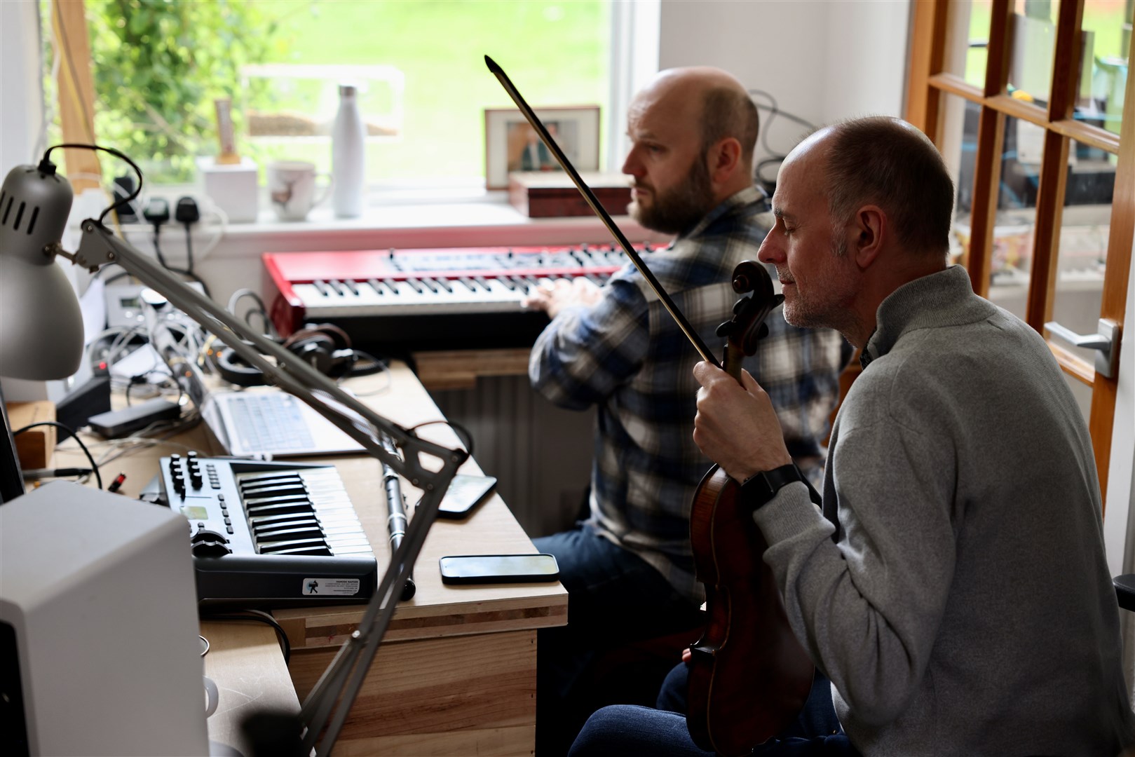 Duncan Chisholm and Hamish Napier at work on the new tune.