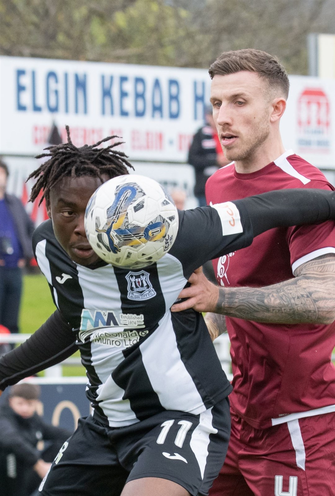Eyes on the ball for Elgin's Michael Dangana and Clyde's Lee Hamilton. Elgin City FC (0) vs Clyde FC (3) - Scottish League Two 23/24 - Borough Briggs, Elgin 4/5/2024.Picture: Daniel Forsyth.