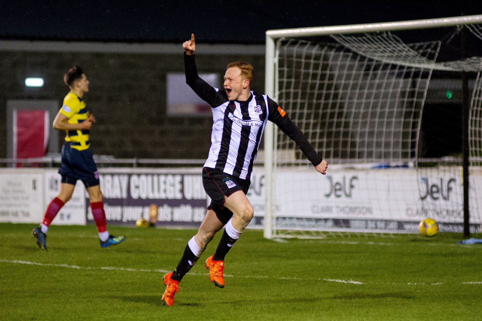 Get in there! Russell Dingwall wheels away in delight after scoring Elgin City's opening goal. Picture: Daniel Forsyth..
