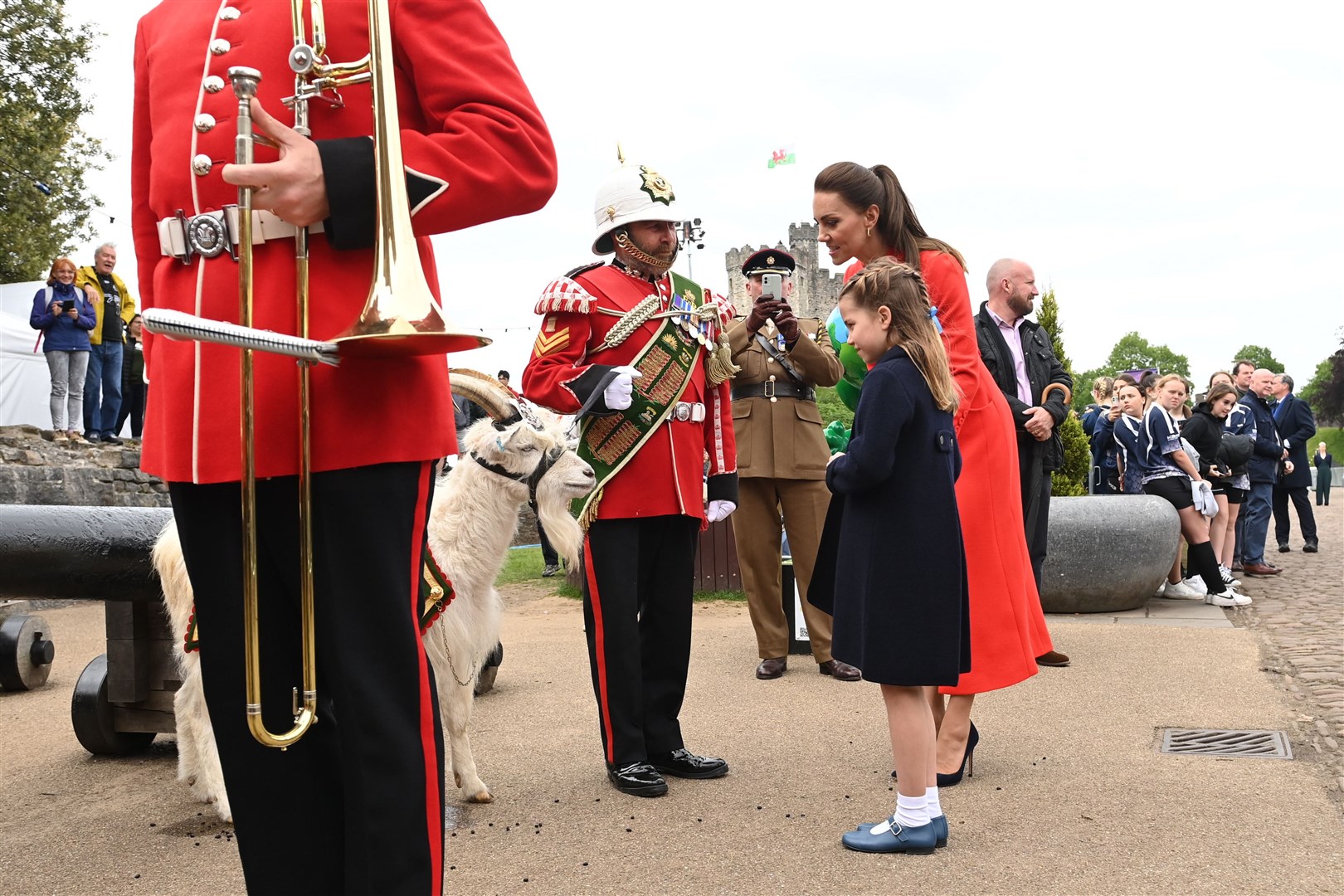 The Duchess of Cambridge and Princess Charlotte meet The Royal Welsh mascot Lance Corporal Shenkin II (Ashley Crowden/PA)