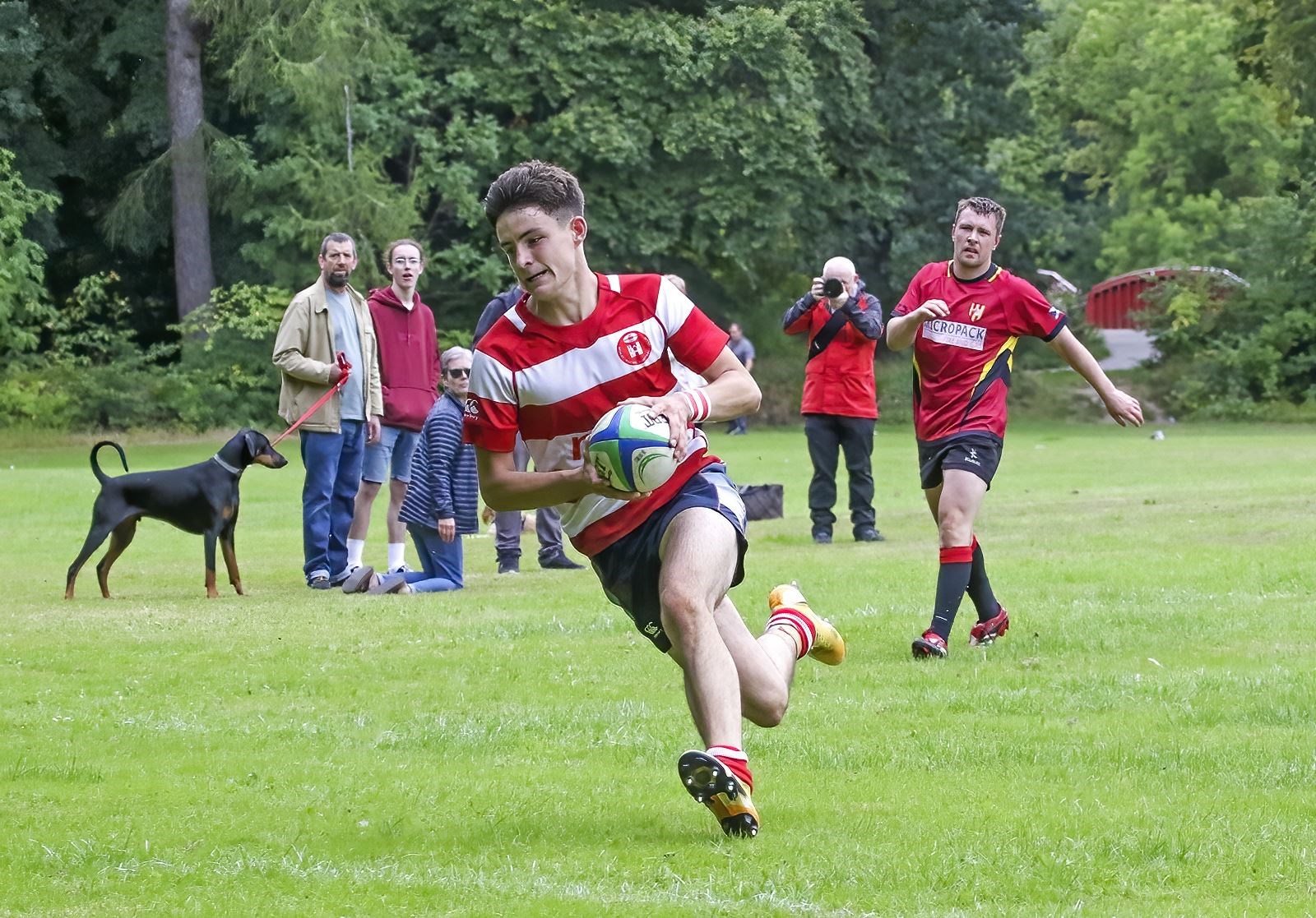 Rory Millar races clear to score another try. Photo: John MacGregor.