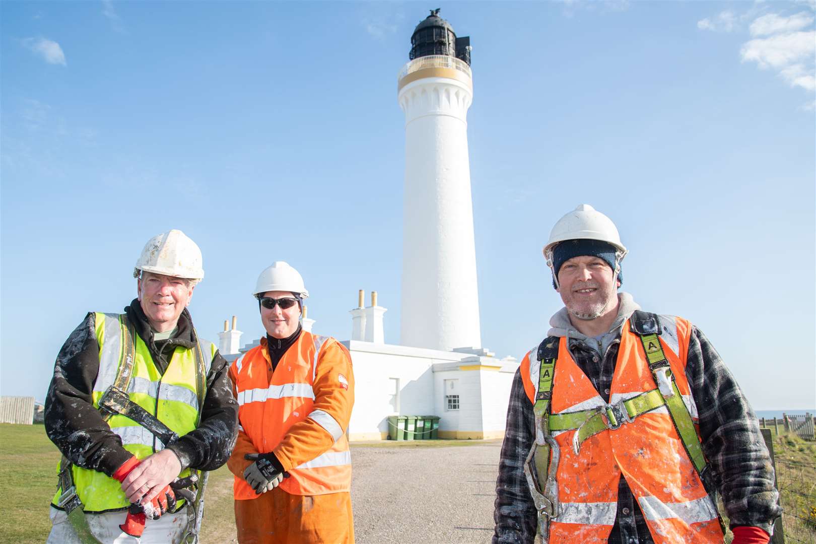From left; Stevie Martin, Ross Simpson and Darren Marshall who painted the lighthouse tower. Picture: Daniel Forsyth