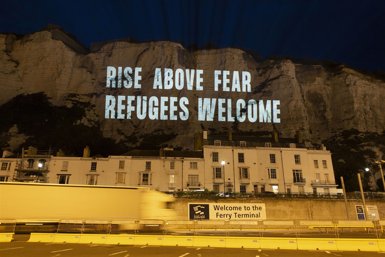 The White Cliffs of Dover lit up with a series of projections in support of migrant welfare (Freedom from Torture/POW)