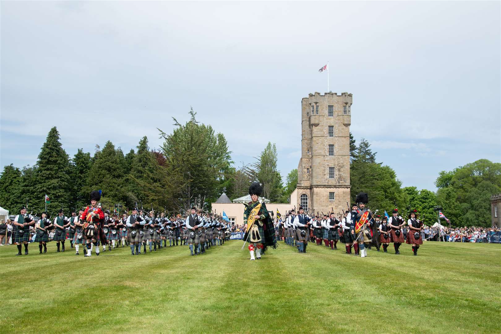 Drum major Derek Dean of Huntly and District leads the massed pipe bands. Picture: Daniel Forsyth
