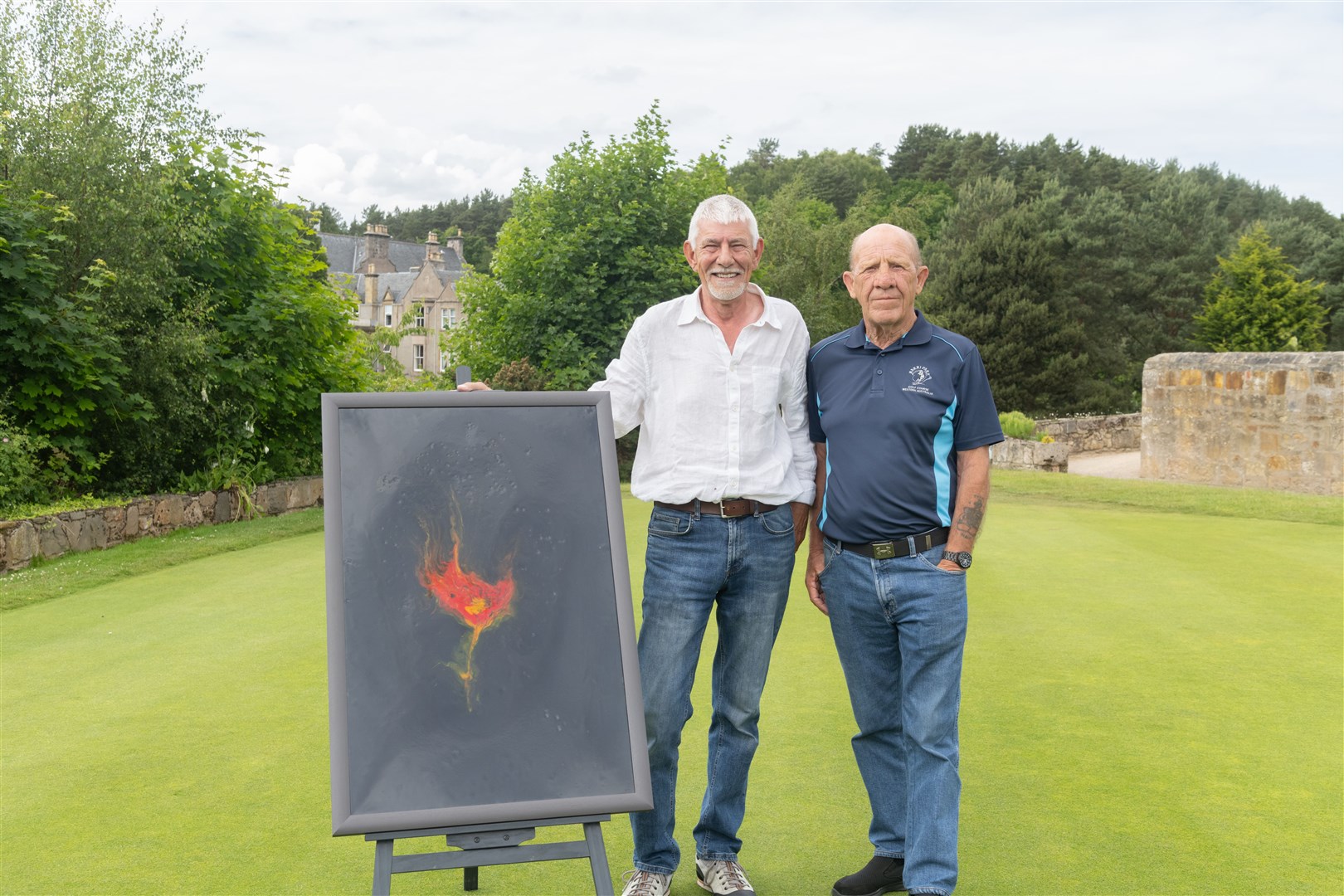Albert Duffus (right) with Walter McKay who painted Poppy Blowing in the Wind, which will be auctioned off at the Mark Duffus Memorial event at Forres Golf Club. ..Picture: Beth Taylor.
