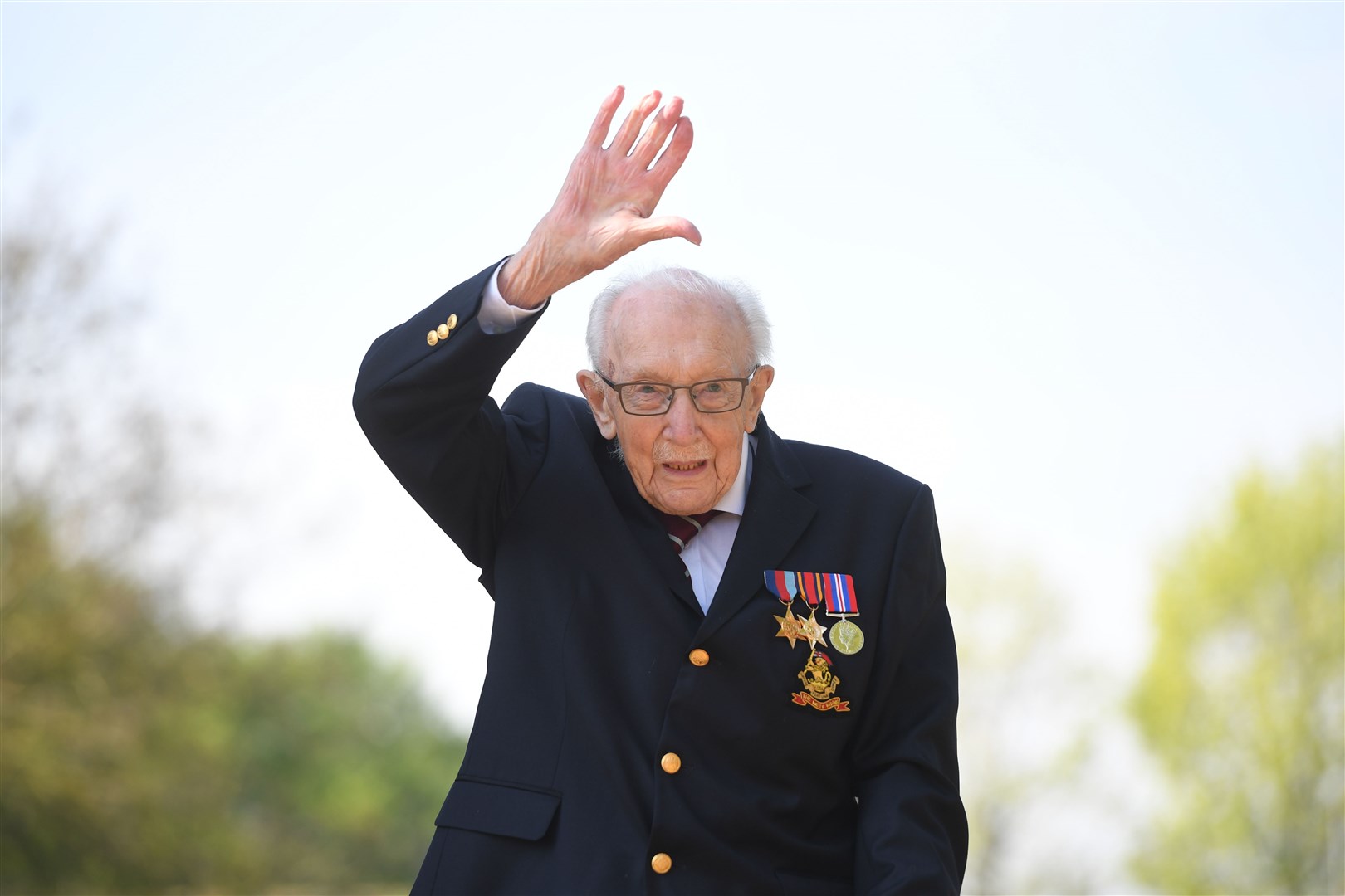 Captain Sir Tom Moore raised £38.9 million for the NHS by walking 100 laps of the garden at the house at the height of the first Covid-19 lockdown (Joe Giddens/PA)