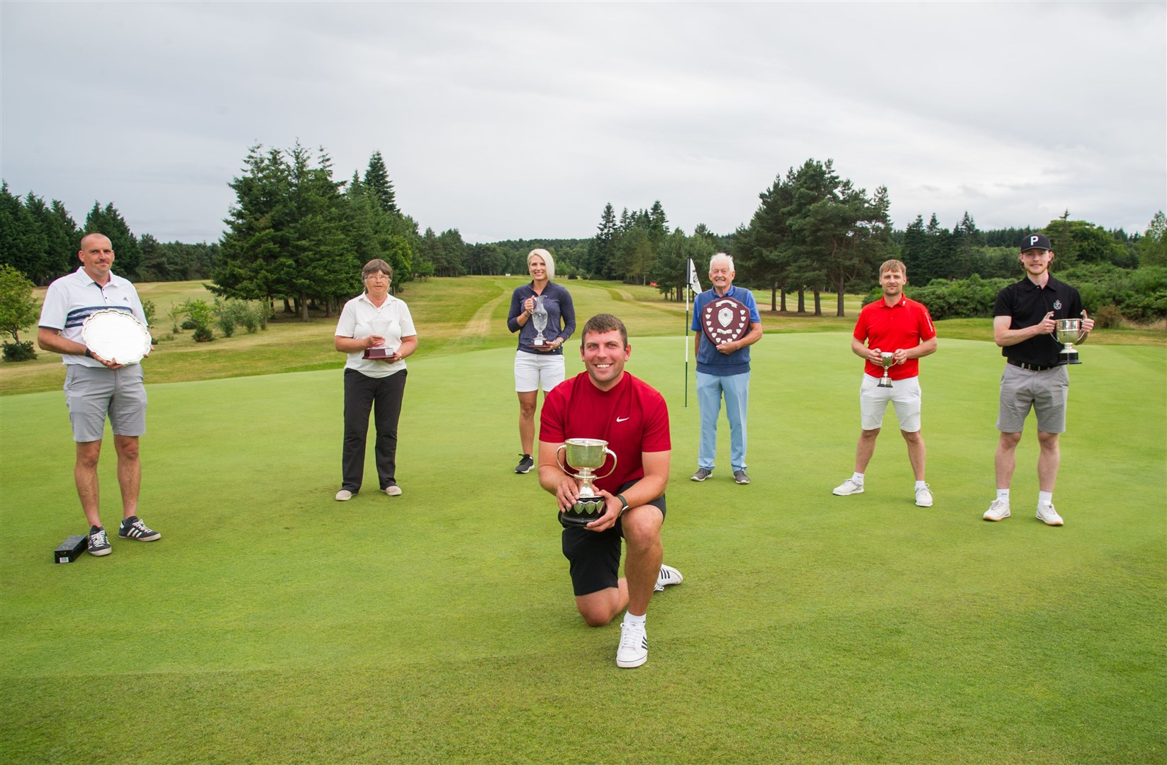 Elgin Golf Club 5-day open winners, from left: Grant Weatherston, Barbara Lock, Rebecca Grant, Bill Thomson, James Pirie and Cameron Milne with Greg Yeates in front. Picture: Becky Saunderson..