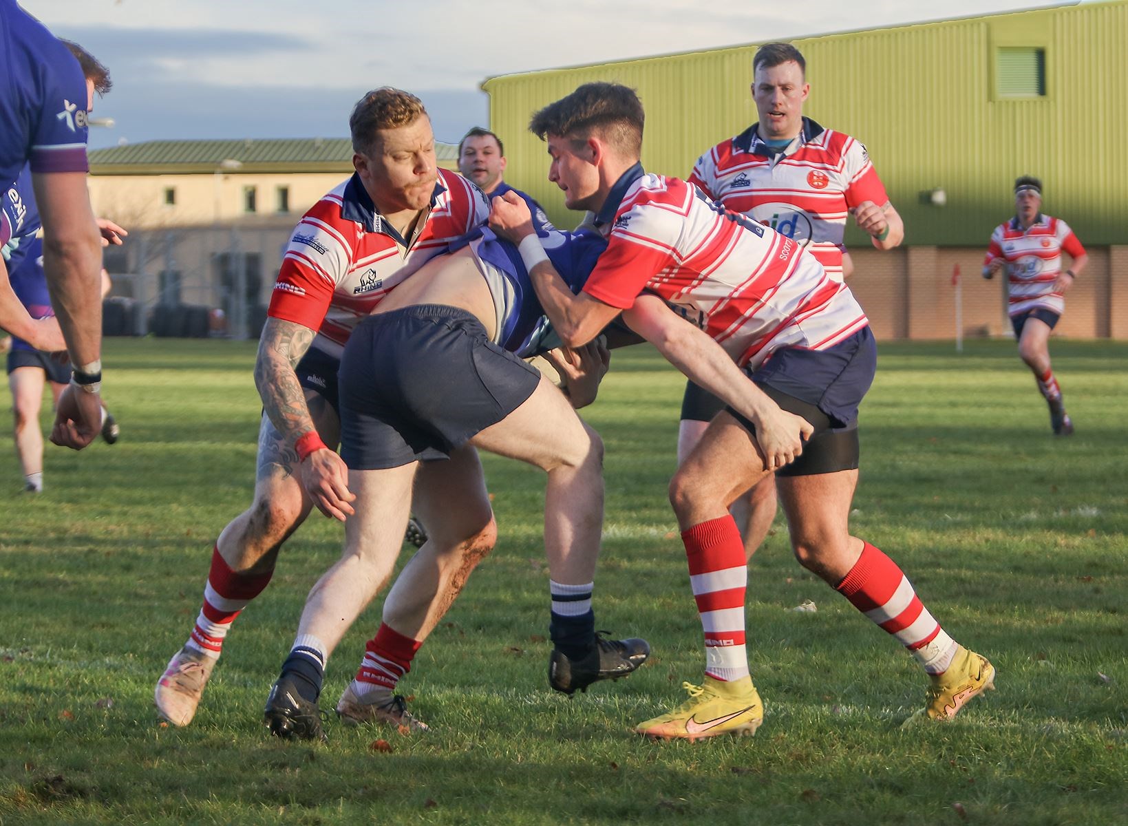 Lewis Scott and Rory Millar tackle. Hugh MacRae coming in to help. Picture: John MacGregor
