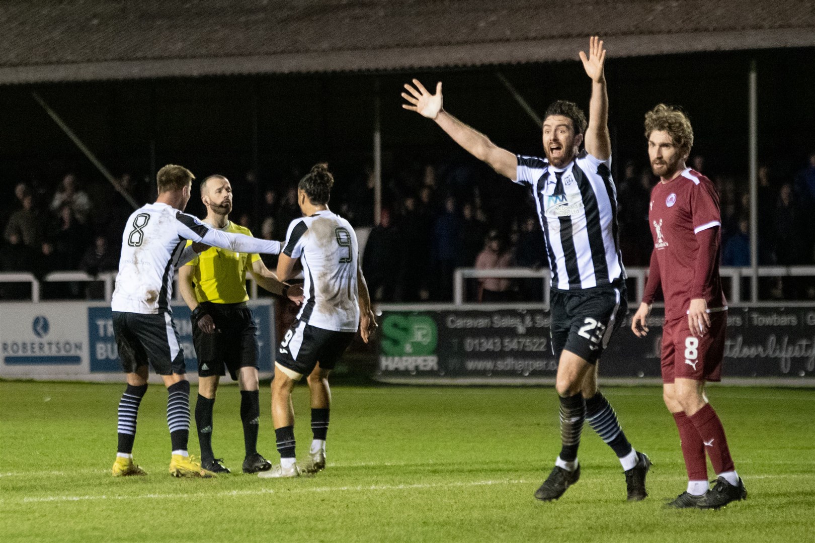 The Elgin City team cannot believe referee George Calder has missed a handball on the Clyde goal line. ..Elgin City FC (2) vs Clyde FC (1) - SPFL League Two 2023/24 - Boroigh Briggs, Elgin 30/01/2024...Picture: Daniel Forsyth..