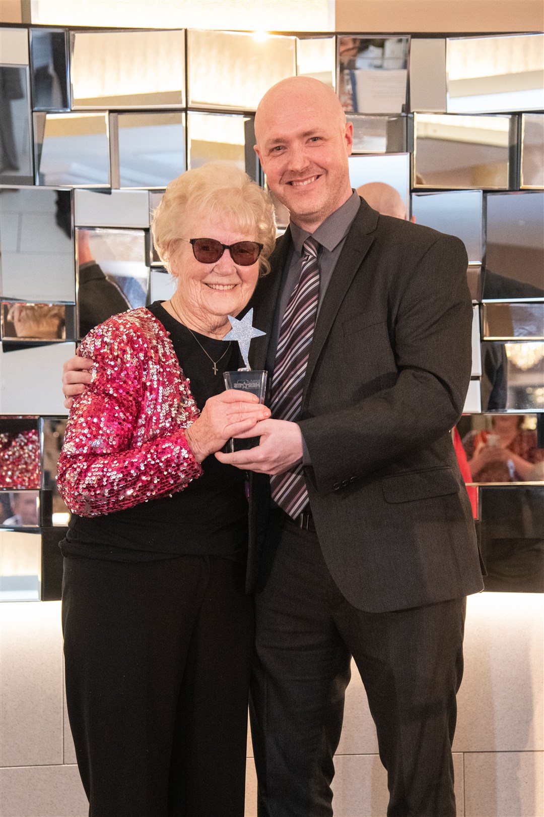 Community Champion Dot Bremner accepts her award from Paul Johnston of Lidl. Picture: Daniel Forsyth