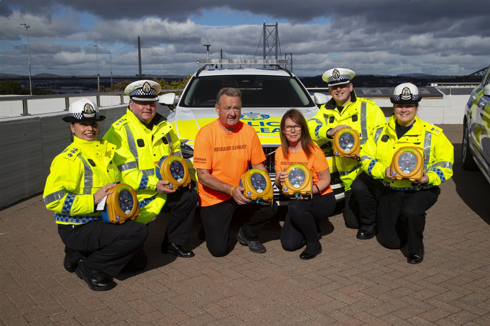 With the new defib equipment are Chief Inspector West Command Lorraine Napier, Chief Inspector East Command Andy Gibb, Gordon McKandie, Sandra McKandie, Chief Inspector North Andy Barclay and Chief Superintendent Louise Blakelock.