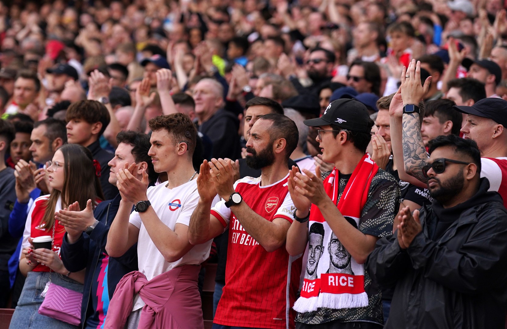 Fans applaud on the 14th minute during Arsenal’s Premier League match against Bournemouth in memory of 14-year-old Daniel Anjorin (Adam Davy/PA)