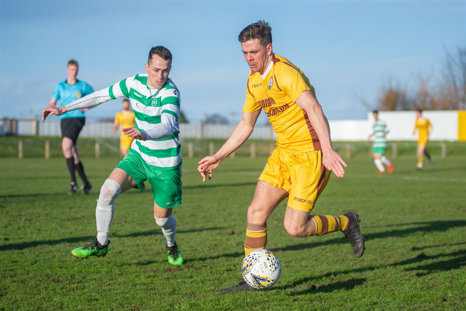 Buckie Thistle's Kevin Fraser closes in on Forres Mechanics' Allan Macphee. Picture: Daniel Forsyth